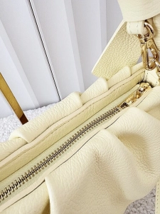 Laura Biaggi torebka kuferek z kokardą skórzana żółta